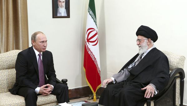 In this Monday, Nov. 23, 2015 photo released by an official website of the office of the Iranian supreme leader, Supreme Leader Ayatollah Ali Khamenei, right, listens to Russian President Vladimir Putin during their meeting in Tehran, Iran - Sputnik International