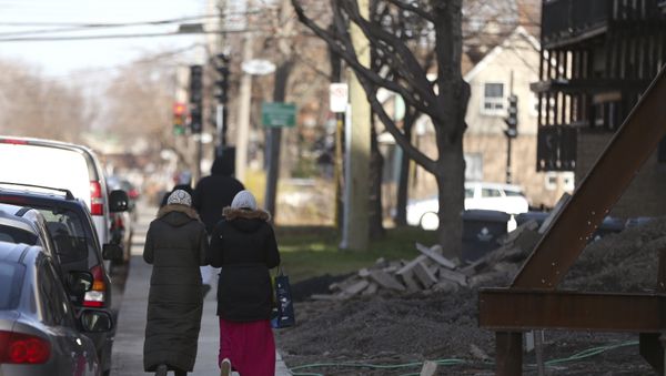 Two women walk down a street in Montreal, November 18, 2015 Two women walk down a street in Montreal, November 18, 2015 - Sputnik International