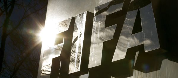 The sun is reflected in FIFA's logo in front of FIFA's headquarters in Zurich, Switzerland November 19, 2015 The sun is reflected in FIFA's logo in front of FIFA's headquarters in Zurich, Switzerland November 19, 2015 - Sputnik International