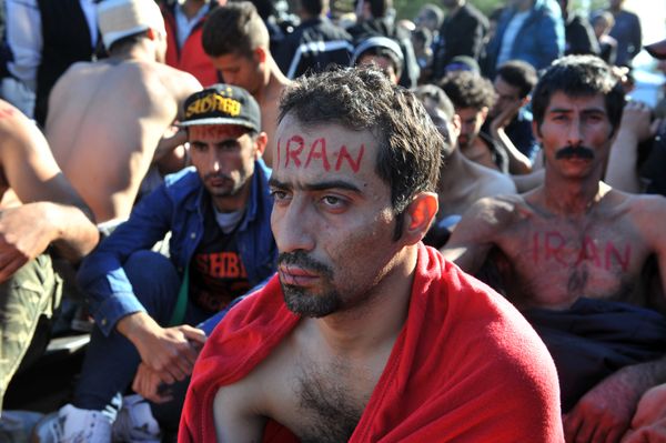 A man from Iran with his mouth sewn shut takes part in a demonstration with fellow migrants and refugees as they wait to cross the border of Greece and Macedonia (also referred as Former Yogaslavia Rebublic of Makedonia) near Idomeni on November 23, 2015. - Sputnik International