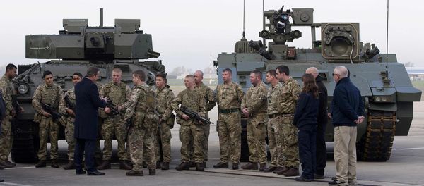Britain's Prime Minister David Cameron (4th) chats with soldiers from the Royal Welsh Infantry as they stand in front of a Lockheed Martin Warrior Infantry Fighting Vehicle (L) and a General Dynamics Ajax Specialist Vehicle (SV) Armoured Fighting Vehicle, at RAF Northolt in London, Britain November 23, 2015 Britain's Prime Minister David Cameron (4th) chats with soldiers from the Royal Welsh Infantry as they stand in front of a Lockheed Martin Warrior Infantry Fighting Vehicle (L) and a General Dynamics Ajax Specialist Vehicle (SV) Armoured Fighting Vehicle, at RAF Northolt in London, Britain November 23, 2015 - Sputnik International
