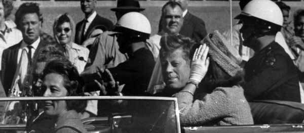 President John F. Kennedy is seen riding in motorcade approximately one minute before he was shot in Dallas, Tx., on Nov. 22, 1963. In the car riding with Kennedy are Mrs. Jacqueline Kennedy, right, Nellie Connally, left, and her husband, Gov. John Connally of Texas. - Sputnik International