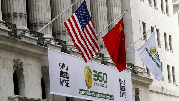 A sign advertising the Qihoo 360 Technology Co Ltd is hung with the U.S. and Chinese flags outside of the New York Stock Exchange before the company's Initial Public Offering (IPO) in New York in this March 30, 2011 file picture - Sputnik International