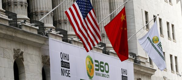 A sign advertising the Qihoo 360 Technology Co Ltd is hung with the U.S. and Chinese flags outside of the New York Stock Exchange before the company's Initial Public Offering (IPO) in New York in this March 30, 2011 file picture - Sputnik International