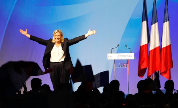 France’s far-right National Front president Marine Le Pen, center, surrounded by members, waves to supporters after her speech during their meeting in Marseille, southern France, Saturday, Sept. 6, 2015. - Sputnik International