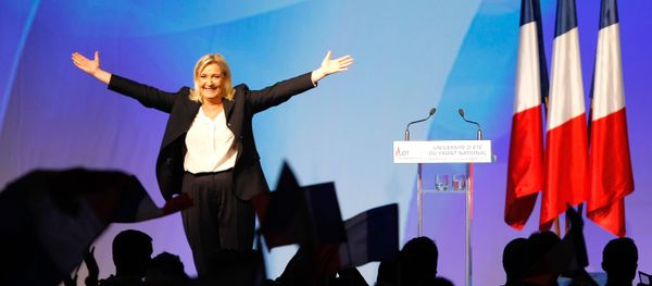France’s far-right National Front president Marine Le Pen, center, surrounded by members, waves to supporters after her speech during their meeting in Marseille, southern France, Saturday, Sept. 6, 2015. - Sputnik International