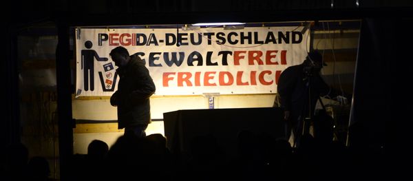 Pegida founder Lutz Bachmann is silhouetted during a demonstration of PEGIDA (Patriotic Europeans against the Islamization of the West) in Dresden, eastern Germany, Monday, Nov. 2, 2015. Pegida founder Lutz Bachmann is silhouetted during a demonstration of PEGIDA (Patriotic Europeans against the Islamization of the West) in Dresden, eastern Germany, Monday, Nov. 2, 2015. - Sputnik International