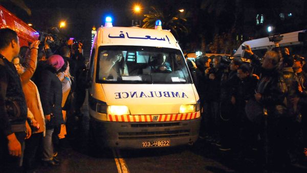 An ambulance rushes to the scene of a bus explosion in the center of the capital, Tunis, Tunisia, Tuesday, Nov. 24, 2015. - Sputnik International