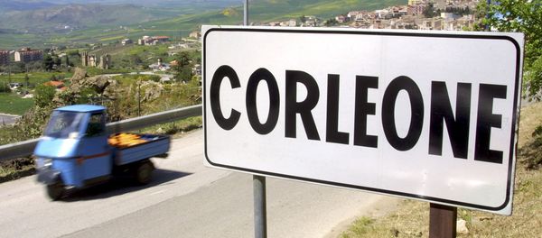 A villager drives a small moto ape utility truck past a road sign in the small Sicilian town of Corleone, Italy in this April 12, 2006 file photo A villager drives a small moto ape utility truck past a road sign in the small Sicilian town of Corleone, Italy in this April 12, 2006 file photo - Sputnik International
