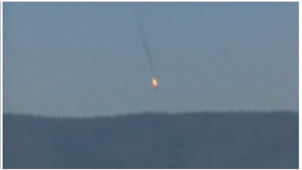 A war plane crashing in flames in a mountainous area in northern Syria after it was shot down by Turkish fighter jets near the Turkish-Syrian border, is seen in this still image taken from video November 24, 2015 - Sputnik International