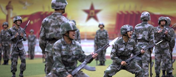 Chinese People's Liberation Army cadets shout as they take part in a bayonet drills at the PLA's Armoured Forces Engineering Academy Base, on the outskirts of Beijing, China, July 22, 2014 Chinese People's Liberation Army cadets shout as they take part in a bayonet drills at the PLA's Armoured Forces Engineering Academy Base, on the outskirts of Beijing, China, July 22, 2014 - Sputnik International