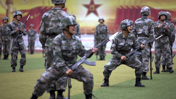 Chinese People's Liberation Army cadets shout as they take part in a bayonet drills at the PLA's Armoured Forces Engineering Academy Base, on the outskirt of Beijing, China Tuesday, July 22, 2014. Chinese People's Liberation Army cadets shout as they take part in a bayonet drills at the PLA's Armoured Forces Engineering Academy Base, on the outskirt of Beijing, China Tuesday, July 22, 2014. - Sputnik International
