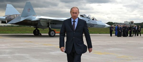 Vladimir Putin at the testing grounds of a Sukhoi T-50 fifth generation fighter. - Sputnik International