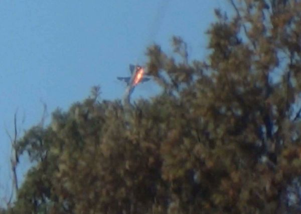 The Russian Su-24 bomber crashes in flames in a mountainous area in northern Syria after it was shot down by Turkish fighter jets near the Turkish-Syrian border November 24, 2015. - Sputnik International