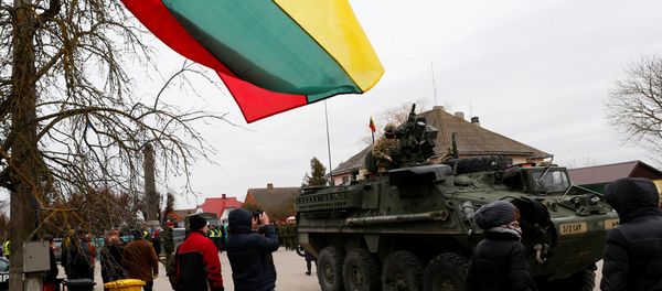 Local residents watch as a members of US Army’s 2nd Cavalry Regiment ride on an armored vehicle during the ''Dragoon Ride'' military exercise, in Salociai some 178 kms (110 miles) north of the capital Vilnius, Lithuania, Monday, March 23, 2015. Local residents watch as a members of US Army’s 2nd Cavalry Regiment ride on an armored vehicle during the ''Dragoon Ride'' military exercise, in Salociai some 178 kms (110 miles) north of the capital Vilnius, Lithuania, Monday, March 23, 2015. - Sputnik International