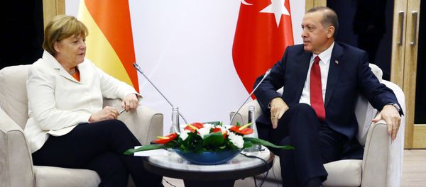 Turkish President Recep Tayyip Erdogan (R) meets German Chancellor Angela Merkel (L) during the G20 Summit in Antalya, on November 16, 2015 Turkish President Recep Tayyip Erdogan (R) meets German Chancellor Angela Merkel (L) during the G20 Summit in Antalya, on November 16, 2015 - Sputnik International
