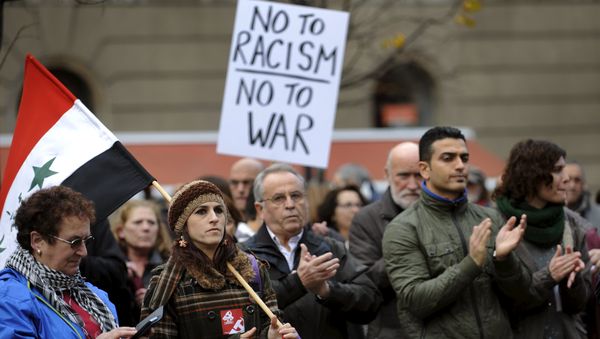 People attend a rally held in one of over 20 Spanish cities under the slogan Not In My Name, to protest against militant attacks and war, in Gijon, northern Spain, November 28, 2015. People attend a rally held in one of over 20 Spanish cities under the slogan Not In My Name, to protest against militant attacks and war, in Gijon, northern Spain, November 28, 2015. - Sputnik International