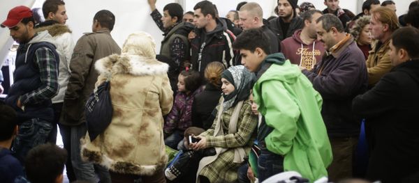 Migrants wait for registration at the central registration center for refugees and asylum seekers in Berlin - Sputnik International