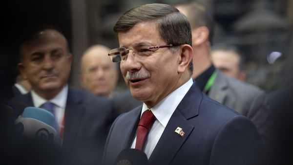 Turkish Prime Minister Ahmet Davutoglu speaks to the press as he arrives for a summit on relations between the European Union and Turkey and on the migration crisis at the EU headquarters in Brussels on November 29, 2015. - Sputnik International