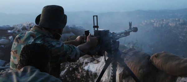 Syrian army personnel fire a machine gun in Latakia province, about 12 miles from the border with Turkey, Syria (File) Syrian army personnel fire a machine gun in Latakia province, about 12 miles from the border with Turkey, Syria (File) - Sputnik International