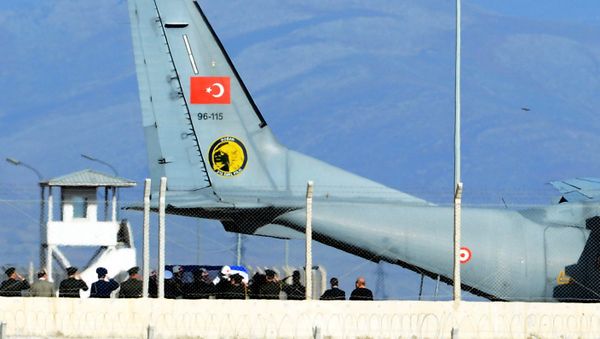 Turkish army officers salute as Turkish honour guard carry the coffin of Russian pilot Lt. Col. Oleg Peshkov into a Turkish Air force transport plane at Hatay airport, Turkey, Sunday, Nov. 29, 2015 Turkish army officers salute as Turkish honour guard carry the coffin of Russian pilot Lt. Col. Oleg Peshkov into a Turkish Air force transport plane at Hatay airport, Turkey, Sunday, Nov. 29, 2015 - Sputnik International