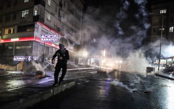 Police use teargas to disperse masked militants protesting the killing of Tahir Elci, a prominent lawyer and human rights defender, who faced a prison term on charges of supporting Kurdish rebels, in Istanbul, Turkey, late Saturday, Nov. 28, 2015 - Sputnik International
