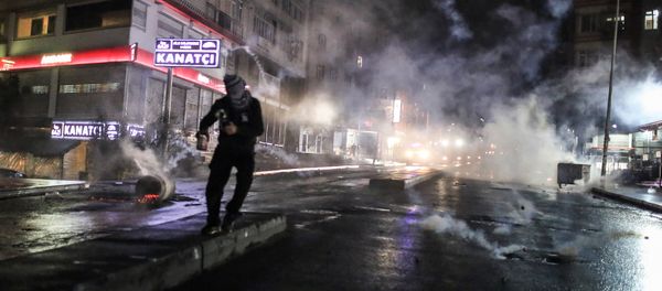 Police use teargas to disperse masked militants protesting the killing of Tahir Elci, a prominent lawyer and human rights defender, who faced a prison term on charges of supporting Kurdish rebels, in Istanbul, Turkey, late Saturday, Nov. 28, 2015 Police use teargas to disperse masked militants protesting the killing of Tahir Elci, a prominent lawyer and human rights defender, who faced a prison term on charges of supporting Kurdish rebels, in Istanbul, Turkey, late Saturday, Nov. 28, 2015 - Sputnik International