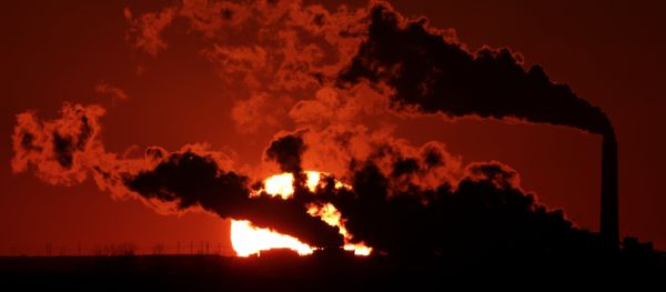 In this March 8, 2014, file photo steam from the Jeffrey Energy Center coal-fired power plant is silhouetted against the setting sun near St. Marys, Kan. In this March 8, 2014, file photo steam from the Jeffrey Energy Center coal-fired power plant is silhouetted against the setting sun near St. Marys, Kan. - Sputnik International