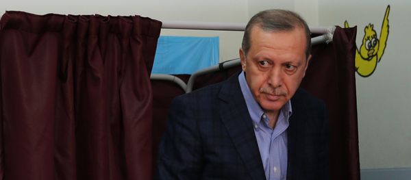 Turkey's President Recep Tayyip Erdogan leaves a voting booth as he prepares to cast his vote at a polling station, in Istanbul, Sunday, Nov. 1, 2015 - Sputnik International