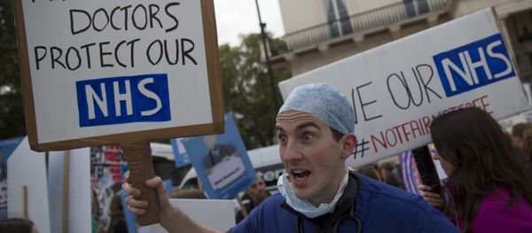 A protester holds a placard at a demonstration in support of junior doctors in London, in this file photograph dated October 17, 2015 A protester holds a placard at a demonstration in support of junior doctors in London, in this file photograph dated October 17, 2015 - Sputnik International