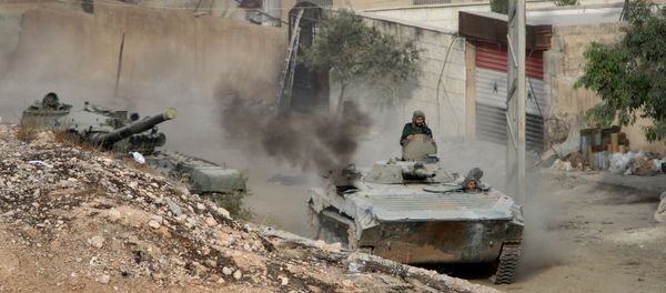 Syrian APC is followed by a tank in Harasta, northeast of Damascus, Syria, Thursday, Oct. 22, 2015 Syrian APC is followed by a tank in Harasta, northeast of Damascus, Syria, Thursday, Oct. 22, 2015 - Sputnik International