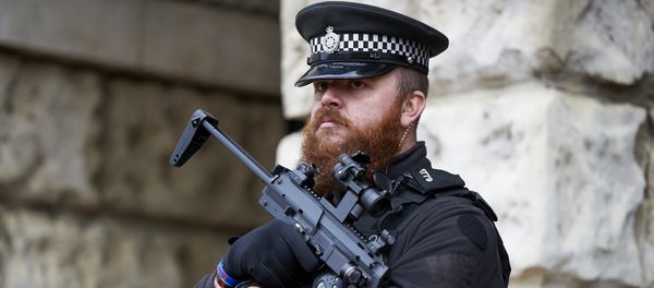 Armed British police officers stand on duty in central London on November 25, 2015 Armed British police officers stand on duty in central London on November 25, 2015 - Sputnik International