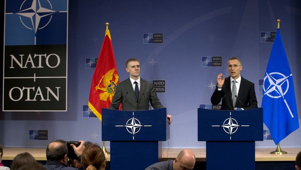 NATO Secretary General Jens Stoltenberg, right, and Montenegro's Foreign Minister Igor Luksic address a media conference at NATO headquarters in Brussels on Wednesday, Dec. 2, 2015 - Sputnik International