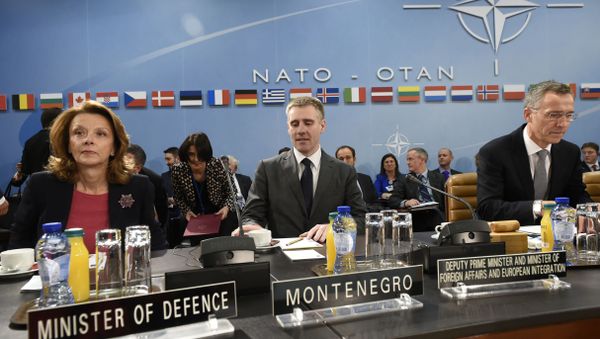Montenegro's Foreign Minister Igor Luksic, center, Montenegro's Defense Minister Milica Pejanovic-Durisic, left, and NATO Secretary General Jens Stoltenberg prepare to address the North Atlantic Council at NATO headquarters in Brussels on Wednesday, Dec. 2, 2015 - Sputnik International