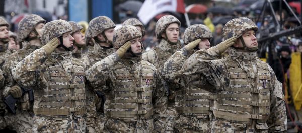 Soldiers from the Latvian army salute as they march during Independence Day military parade in Riga, Latvia, November 18, 2015 Soldiers from the Latvian army salute as they march during Independence Day military parade in Riga, Latvia, November 18, 2015 - Sputnik International