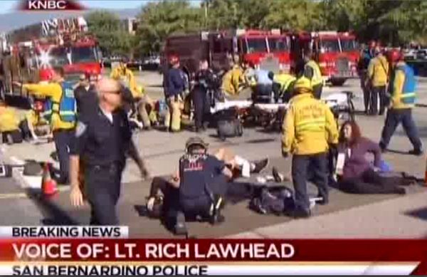 First responders attend to people outside a Southern California social services center in San Bernardino, where one or more gunmen opened fire, shooting multiple people on Wednesday, Dec. 2, 2015. - Sputnik International