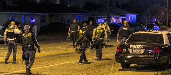 Authorities guard the perimeter near the location of an officer-involved shooting Wednesday, Dec. 2, 2015, in San Bernardino, Calif., following a shooting that killed multiple people at a social services center for the disabled Authorities guard the perimeter near the location of an officer-involved shooting Wednesday, Dec. 2, 2015, in San Bernardino, Calif., following a shooting that killed multiple people at a social services center for the disabled - Sputnik International