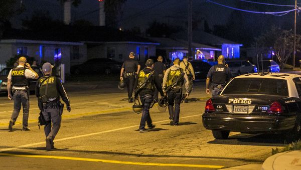 Authorities guard the perimeter near the location of an officer-involved shooting Wednesday, Dec. 2, 2015, in San Bernardino, Calif., following a shooting that killed multiple people at a social services center for the disabled - Sputnik International