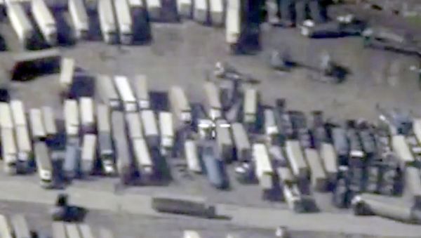 An undated still image taken from a video made available by the Russian Defence Ministry in Moscow, Russia December 2, 2015, shows the Turkish-Syrian border crossing. Russia's defence ministry officials displayed satellite images on Wednesday which they said showed columns of tanker trucks loading with oil at installations controlled by Islamic State in Syria and Iraq, and then crossing the border into neighbouring Turkey An undated still image taken from a video made available by the Russian Defence Ministry in Moscow, Russia December 2, 2015, shows the Turkish-Syrian border crossing. Russia's defence ministry officials displayed satellite images on Wednesday which they said showed columns of tanker trucks loading with oil at installations controlled by Islamic State in Syria and Iraq, and then crossing the border into neighbouring Turkey - Sputnik International