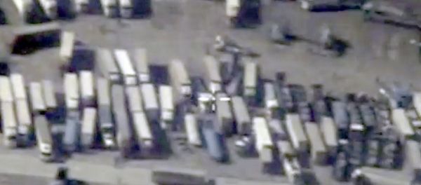 An undated still image taken from a video made available by the Russian Defence Ministry in Moscow, Russia December 2, 2015, shows the Turkish-Syrian border crossing. Russia's defence ministry officials displayed satellite images on Wednesday which they said showed columns of tanker trucks loading with oil at installations controlled by Islamic State in Syria and Iraq, and then crossing the border into neighbouring Turkey An undated still image taken from a video made available by the Russian Defence Ministry in Moscow, Russia December 2, 2015, shows the Turkish-Syrian border crossing. Russia's defence ministry officials displayed satellite images on Wednesday which they said showed columns of tanker trucks loading with oil at installations controlled by Islamic State in Syria and Iraq, and then crossing the border into neighbouring Turkey - Sputnik International