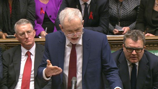 Opposition Labour Party leader, Jeremy Corbyn, center, stands as he makes a speech to lawmakers inside the House of Commons in London, during a debate on launching airstrikes against Islamic State extremists inside Syria, Wednesday, Dec. 2, 2015. Opposition Labour Party leader, Jeremy Corbyn, center, stands as he makes a speech to lawmakers inside the House of Commons in London, during a debate on launching airstrikes against Islamic State extremists inside Syria, Wednesday, Dec. 2, 2015. - Sputnik International