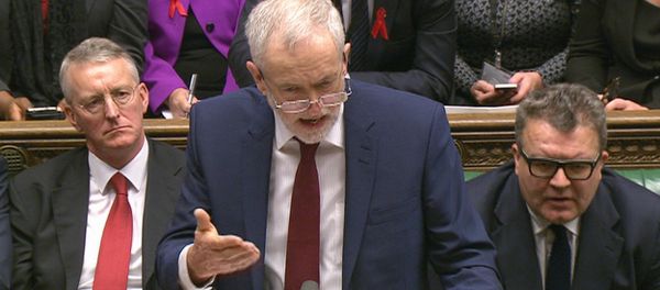 Opposition Labour Party leader, Jeremy Corbyn, center, stands as he makes a speech to lawmakers inside the House of Commons in London, during a debate on launching airstrikes against Islamic State extremists inside Syria, Wednesday, Dec. 2, 2015. Opposition Labour Party leader, Jeremy Corbyn, center, stands as he makes a speech to lawmakers inside the House of Commons in London, during a debate on launching airstrikes against Islamic State extremists inside Syria, Wednesday, Dec. 2, 2015. - Sputnik International