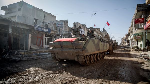 Turkish army's armored vehicles and tanks drive in Syrian town of Ayn al-Arab, also known as Kobani, as they return from the Ottoman tomb in Syria, Sunday, Feb. 22, 2015 Turkish army's armored vehicles and tanks drive in Syrian town of Ayn al-Arab, also known as Kobani, as they return from the Ottoman tomb in Syria, Sunday, Feb. 22, 2015 - Sputnik International