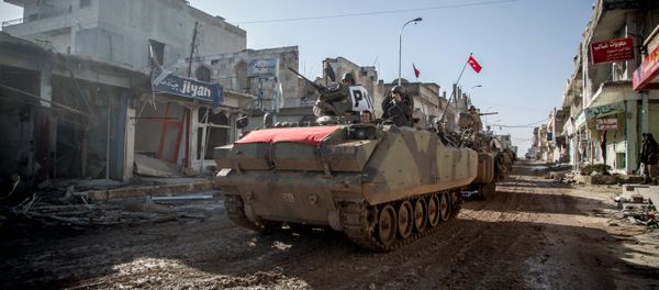 Turkish army's armored vehicles and tanks drive in Syrian town of Ayn al-Arab, also known as Kobani, as they return from the Ottoman tomb in Syria, Sunday, Feb. 22, 2015 Turkish army's armored vehicles and tanks drive in Syrian town of Ayn al-Arab, also known as Kobani, as they return from the Ottoman tomb in Syria, Sunday, Feb. 22, 2015 - Sputnik International