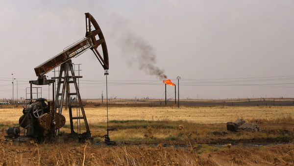 Oil well pumps are seen in the Rmeilane oil field in Syria's northerneastern Hasakeh province on July 15, 2015 Oil well pumps are seen in the Rmeilane oil field in Syria's northerneastern Hasakeh province on July 15, 2015 - Sputnik International