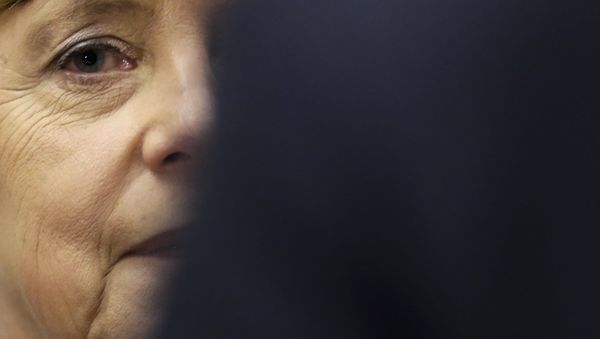 German Chancellor Angela Merkel arrives to a special faction meeting of the Christian Union parties at the Reichstag building in Berlin, Thursday, Nov. 26, 2015. - Sputnik International
