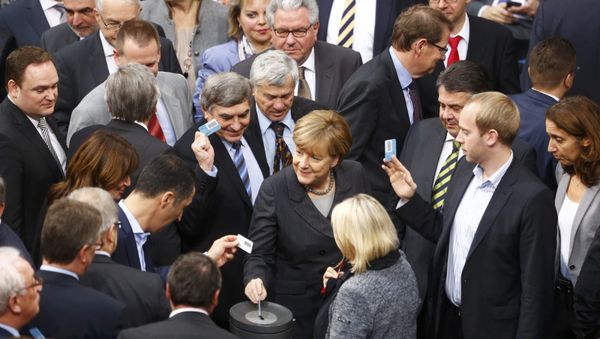 German Chancellor Angela Merkel votes during a session of the Bundestag, the German lower house of parliament, in Berlin, Germany - Sputnik International