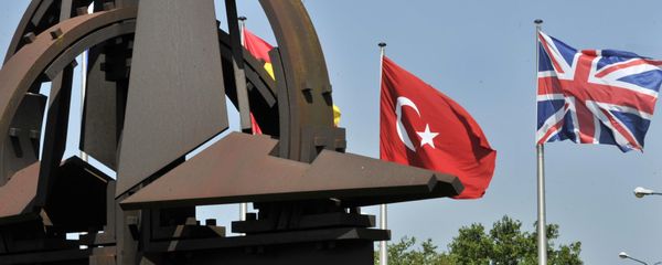 A Turkish and an Union Jack flags are pictured at the NATO Headquarters in Brussels - Sputnik International
