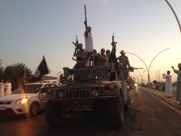 Fighters of the al-Qaida-inspired Islamic State of Iraq and the Levant (ISIL) parade in a commandeered Iraqi security forces armored vehicle down a main road at the northern city of Mosul, Iraq. (File) Fighters of the al-Qaida-inspired Islamic State of Iraq and the Levant (ISIL) parade in a commandeered Iraqi security forces armored vehicle down a main road at the northern city of Mosul, Iraq. (File) - Sputnik International