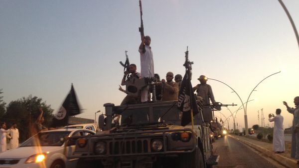 Fighters of the al-Qaida-inspired Islamic State of Iraq and the Levant (ISIL) parade in a commandeered Iraqi security forces armored vehicle down a main road at the northern city of Mosul, Iraq. (File) Fighters of the al-Qaida-inspired Islamic State of Iraq and the Levant (ISIL) parade in a commandeered Iraqi security forces armored vehicle down a main road at the northern city of Mosul, Iraq. (File) - Sputnik International